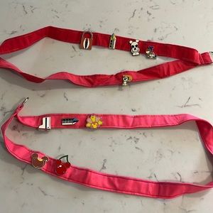Two Disney Lanyards with starter pins (one red and one pink)